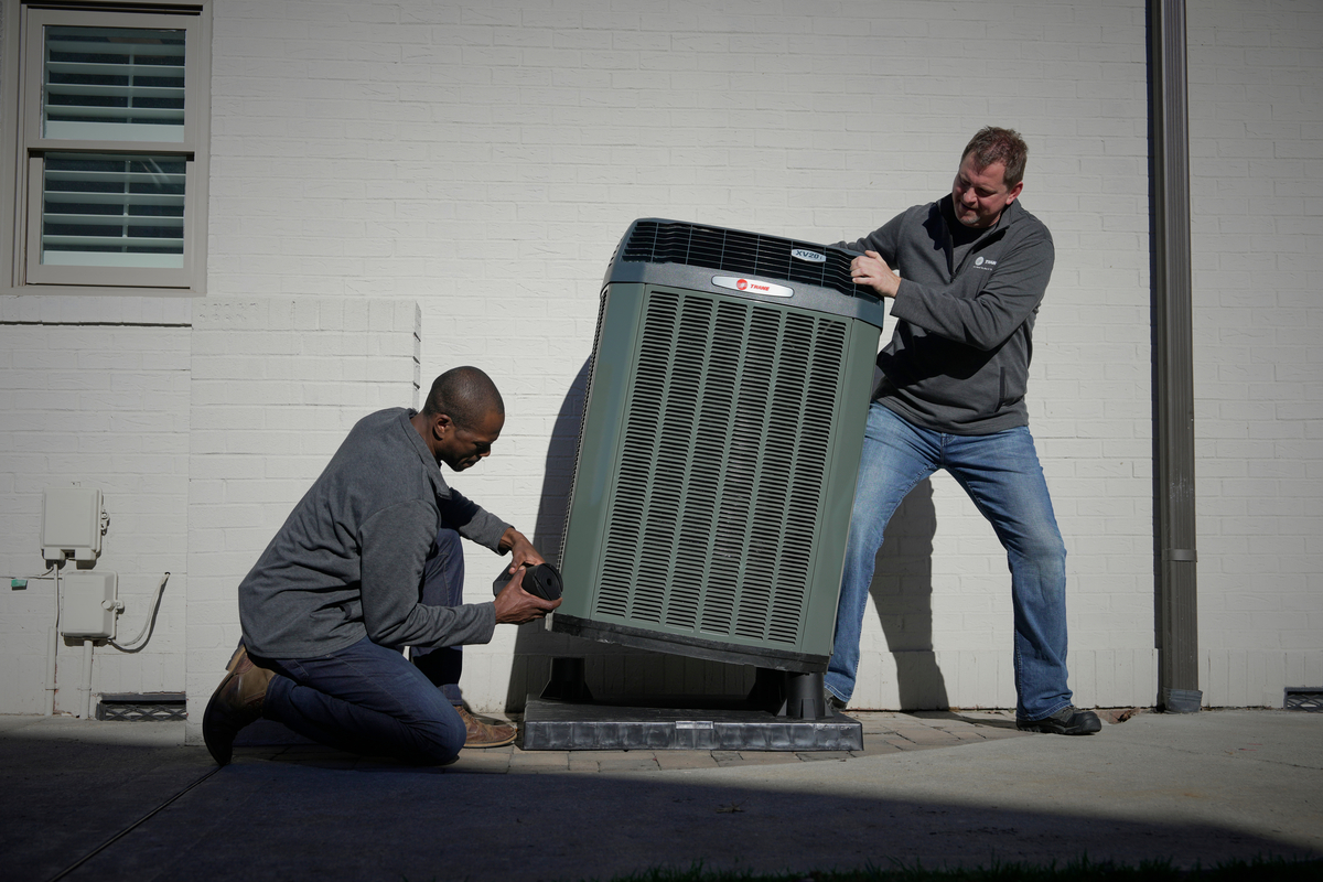 two trane dealers working on unit